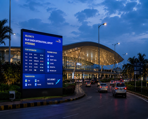 Outdoor LED display installed at airport entrances and transportation infrastructure.